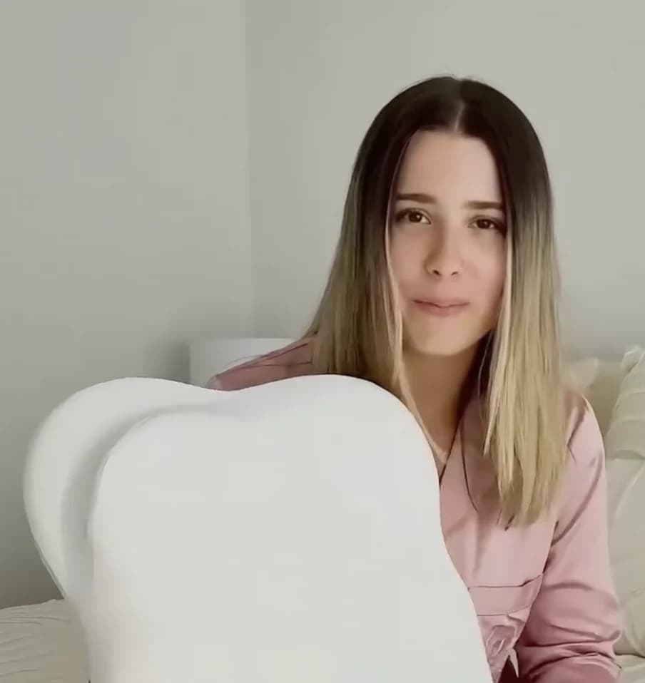 Cloud Pillow customer holding the pillow